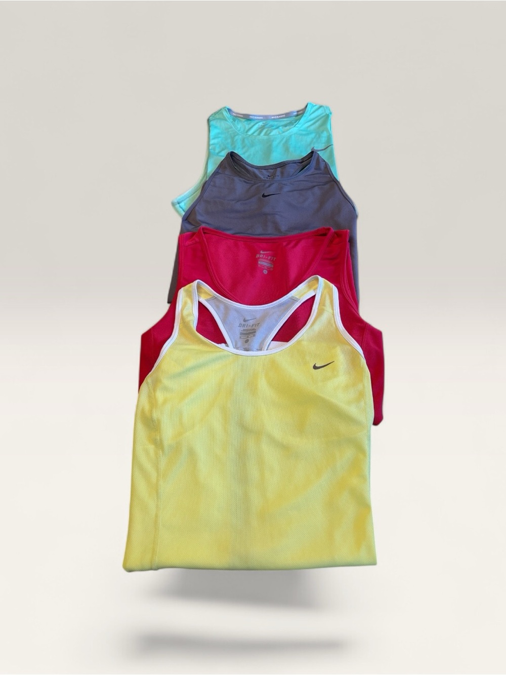 Four Nike Women’s Racerback Tank Tops Bundle - Yellow, Pink, Gray, Aqua